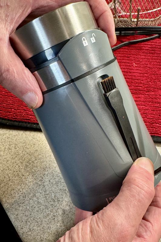 Cleaning brush in its own slot