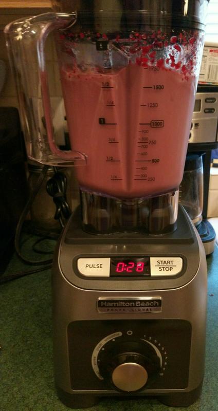 Making chocolate and raspberry milkshakes