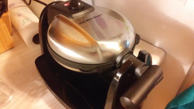 Handle folds in. Light on top lets you know when it is ready.