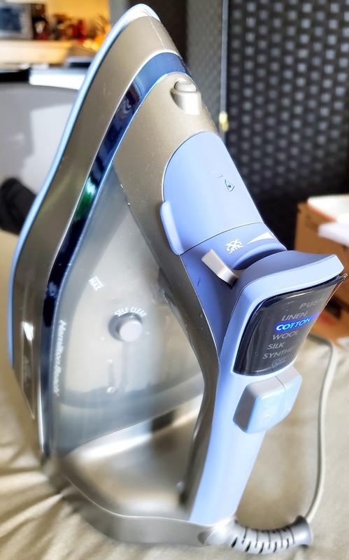 Self-clean button on water chamber