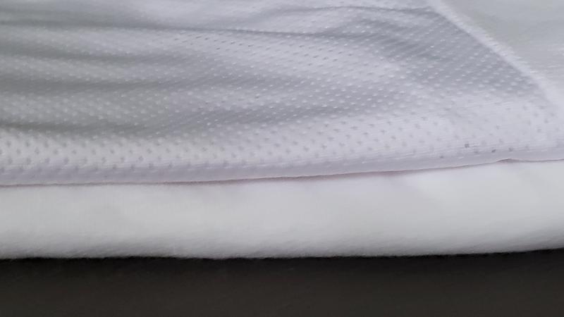 Thinner fabric, as shown when folded. Better comfort under other clothing.