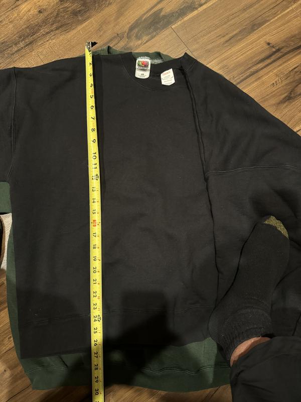 Hanes 3XL laying atop a Fruit of the Loom 2XL.  Hanes 3XL is three inches shorter.