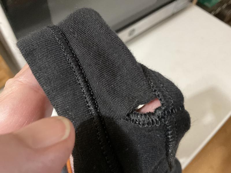 Badly sewn seam missed the material.