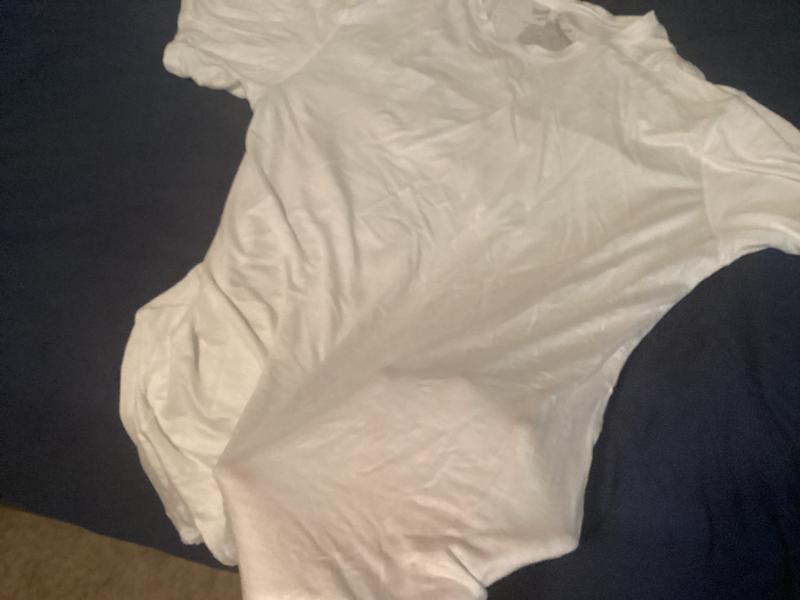 That is my hand. I have pale skin and you can clearly see it through the shirt.