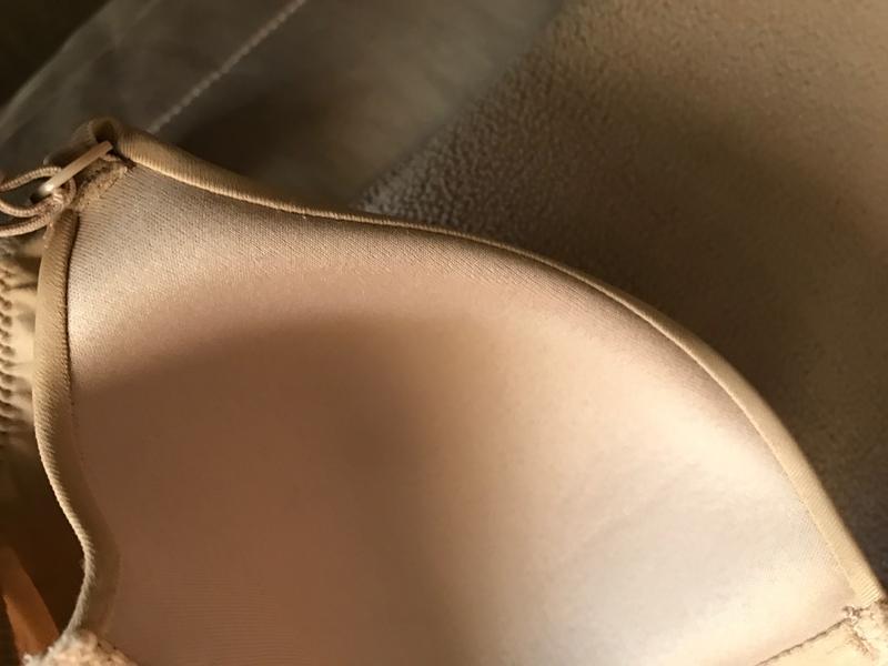 View from inside bra showing outward roll at top of cup.