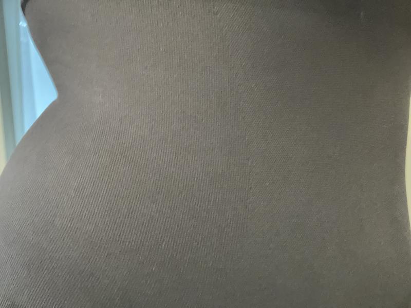 Fitting but no extremely tight. Breathes well.