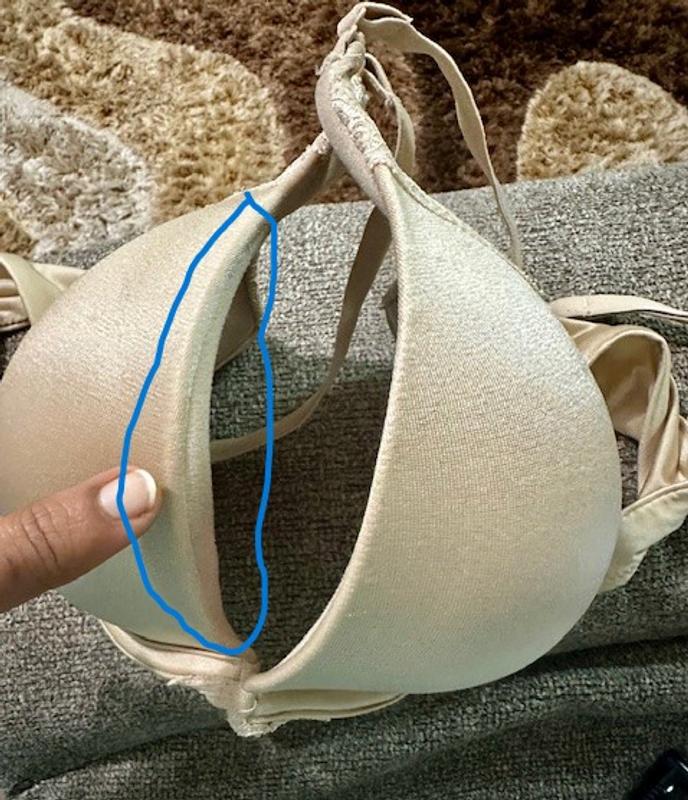 neckline tilted outwards and shows up odd over the dress