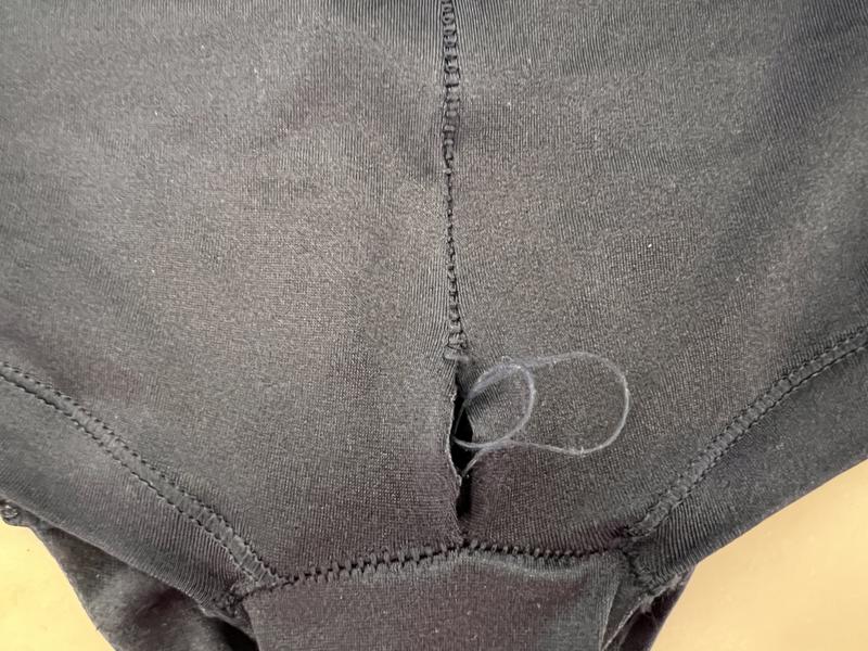 Seam in front right above crotch panel