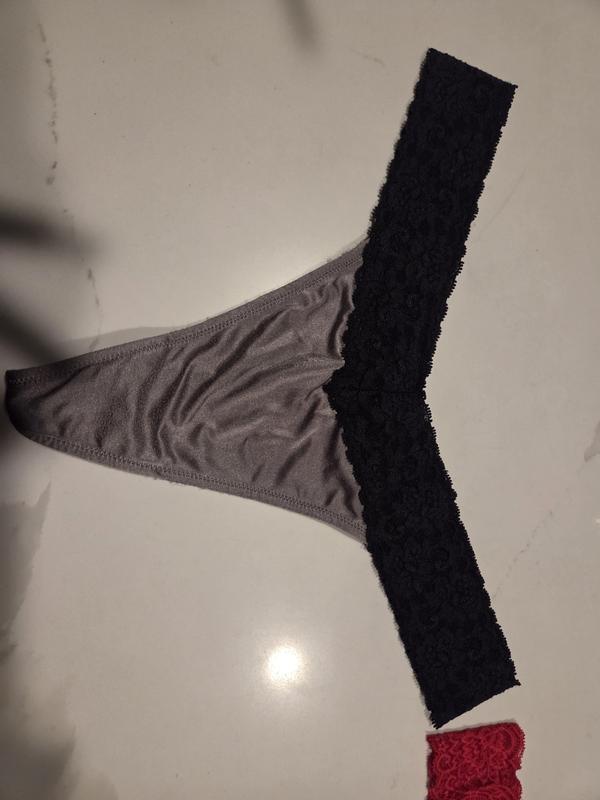 Old v-style thong w/ thinner fabric on front and rear, trimmed w fabric over elastic vs. new straight lace, wide fabric on front and rear, elastic trimmed thong...horrible!