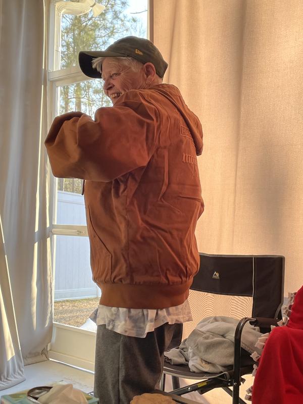 Mom’s excitement trying on her new riding jacket