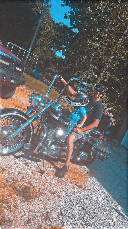 He loving his new helmet so he can ride with his Papa!