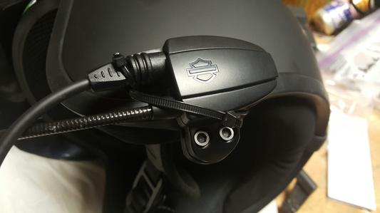 Non-elegant use of 2 each zip ties to hold plug into helmet on this $200 item.