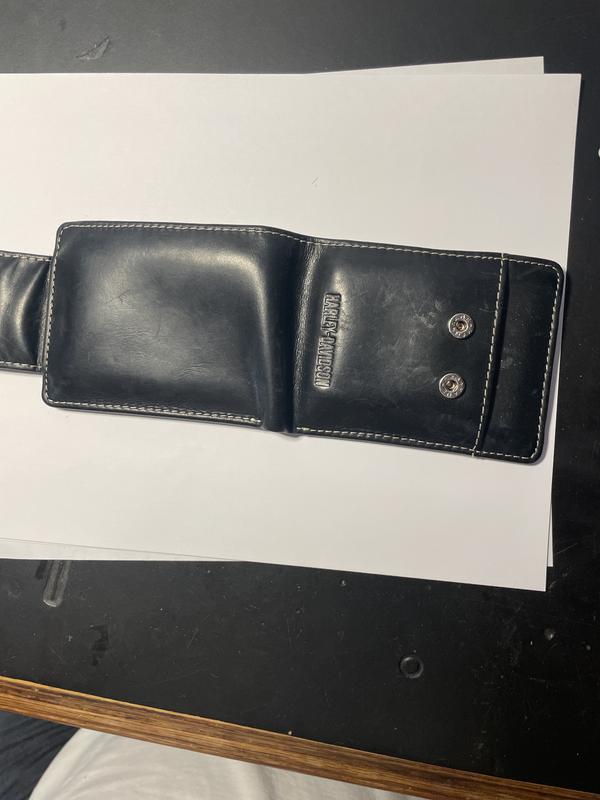 Nice bifold wallet with plenty of room for cards and cash .