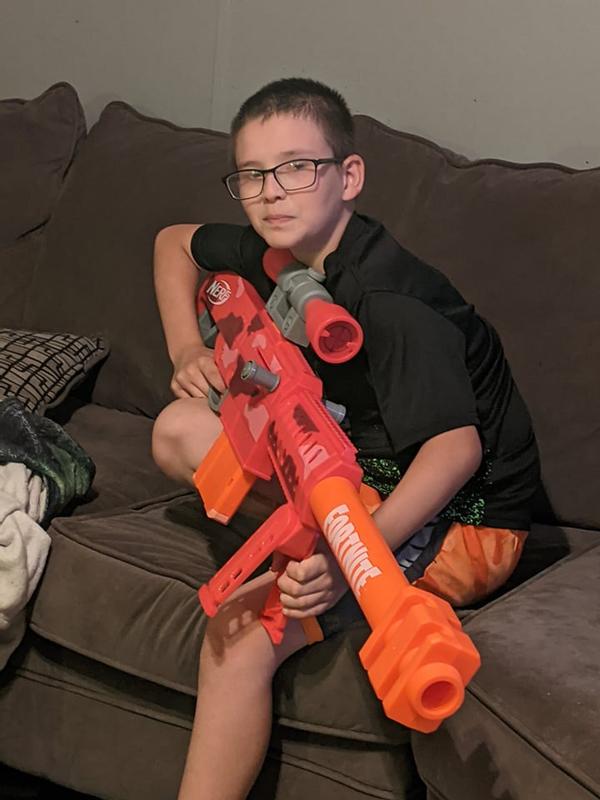 He is ready to shoot this Nerf Gun