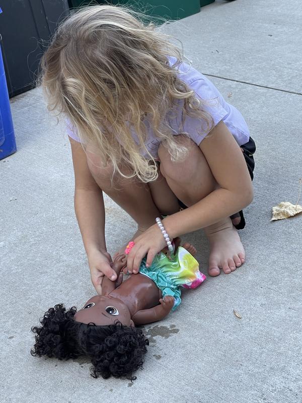 She loves to dress and undress the baby doll!