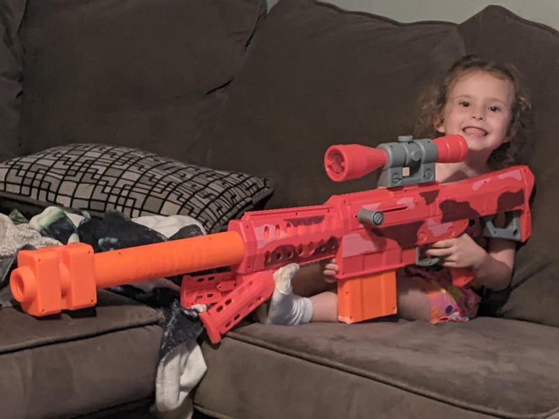 shes tiny but still wants to play with this big nerf gun
