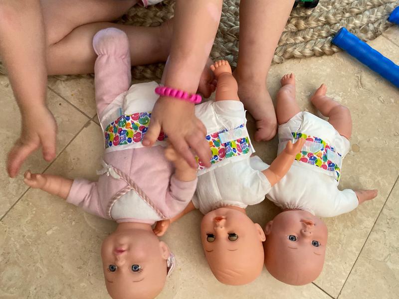 Three baby dolls all changed with clean diapers :)