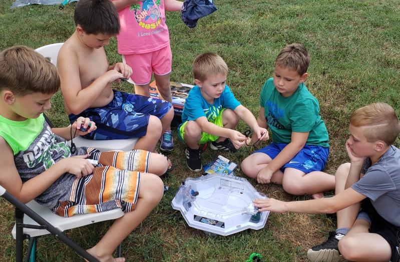 The crew battling their beyblades