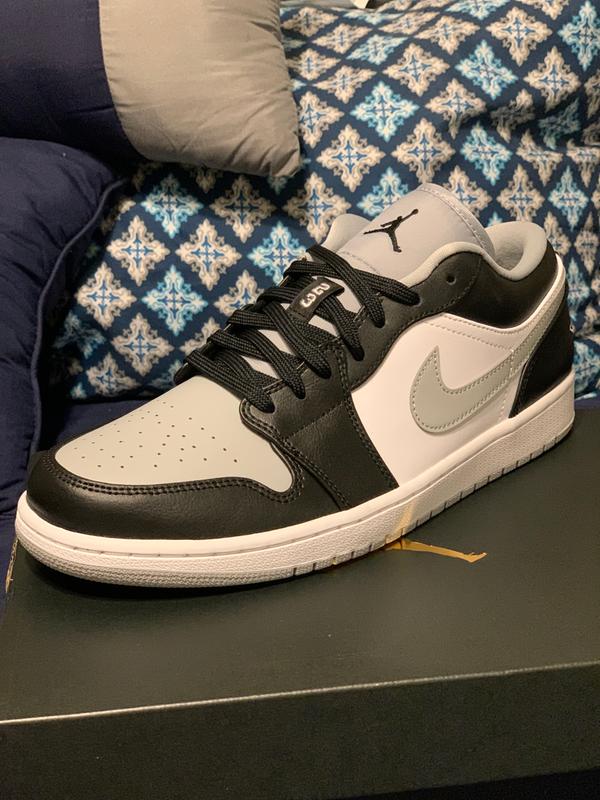 black and grey low top 1s