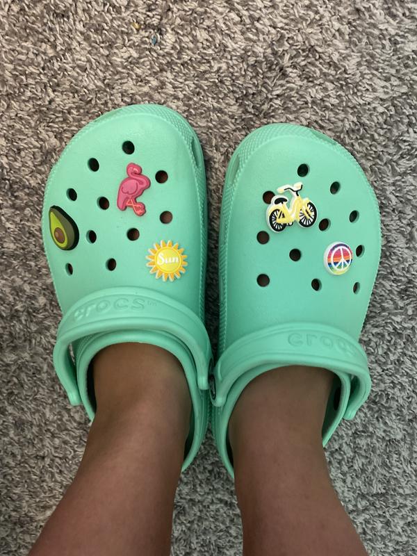 teal crocs with charms