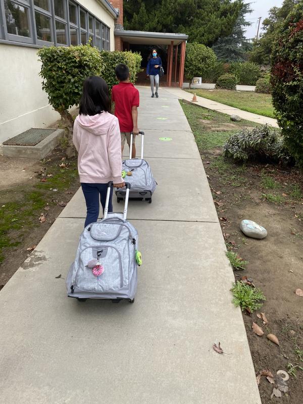 Third grade twins walking into school