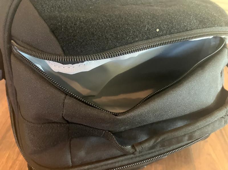 Front zipper pocket doesn't collapse inside main compartment