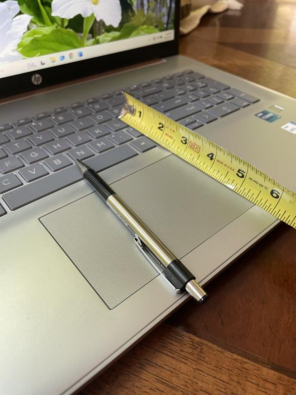 Center of typing area is 6.25" from base edge.
It is awkwardly positioned forward and uncomfortable for lengthy typing times. 
THIS is the biggest con for me.