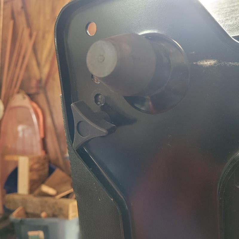 Photos of the seat adjustment. One shows that the front bolt holes do not line up in the forward postion.