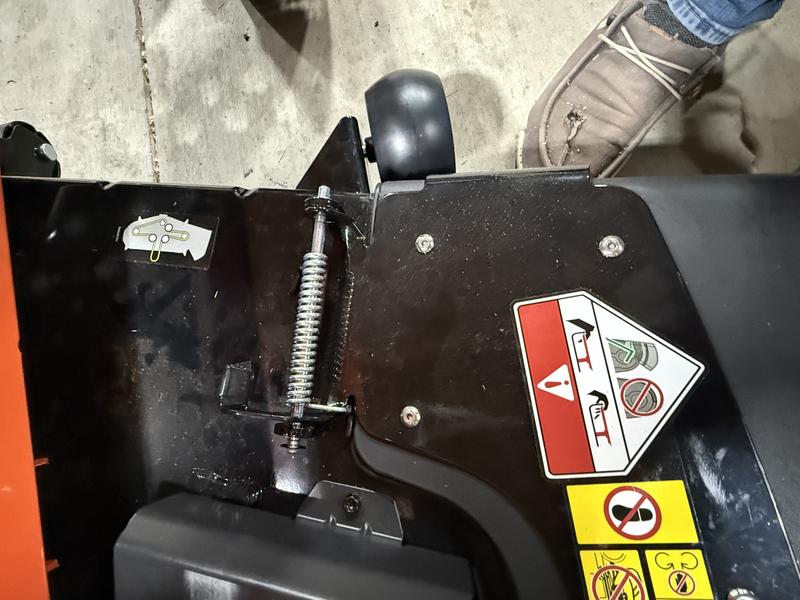 Pin that needs to be cut off in order to remove chute so plastic side cover will fit.