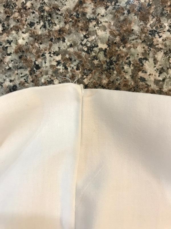 Edge of pillowcase is stitched together uneven