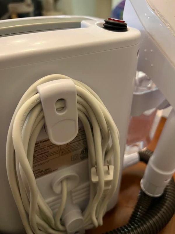 Cord keeper on the back and there is a hose keeper on one side of the machine