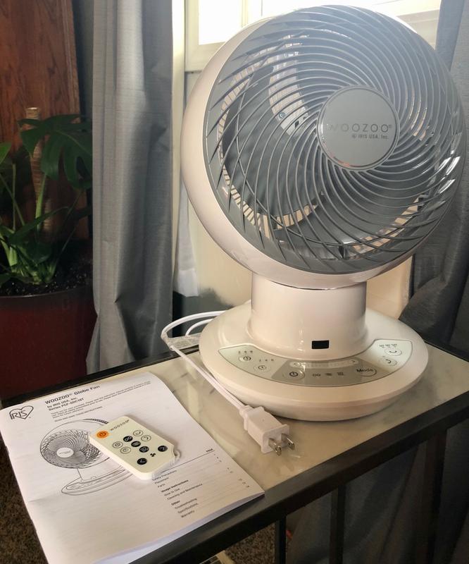 Front view of oscillating globe fan with remote & manual