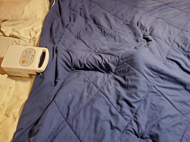 The unit placed under blankets.