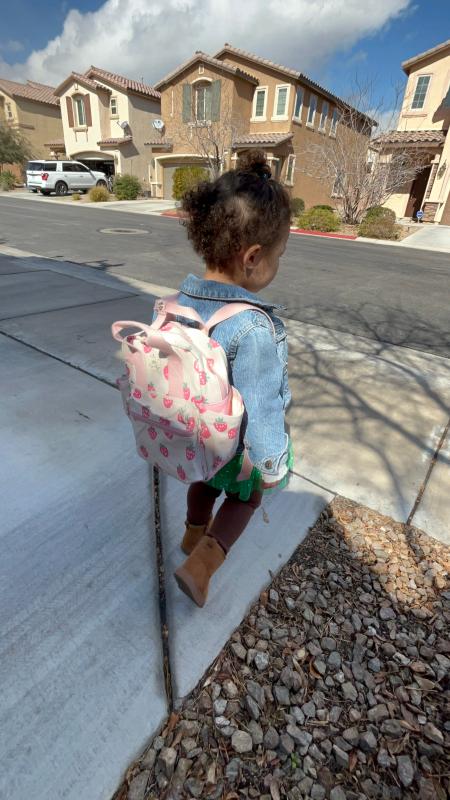 My daughter on the go with her toddler backpack!