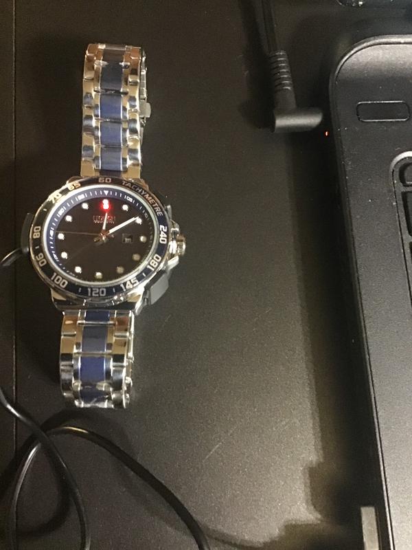 Picture of watch connected to laptop charging