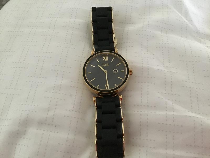 Watch with black and gold links