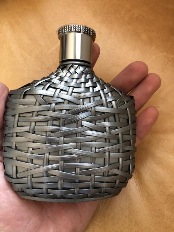 The bottle with my hand to see size