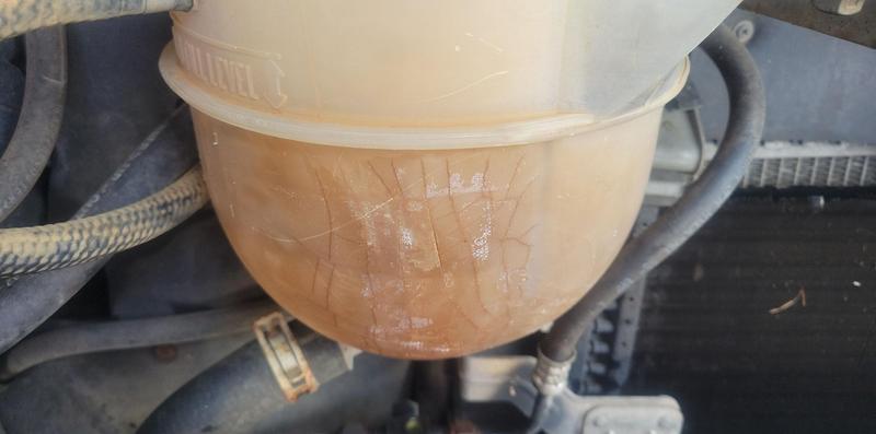 Overflow pressure bottle, riddled with stress cracks.