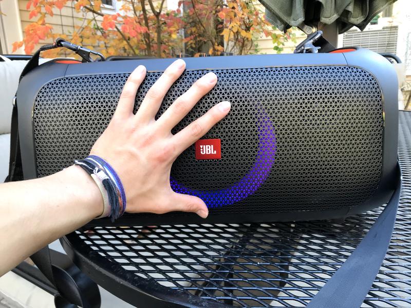 Front view of speaker with hand for size reference. (Average size male hand)