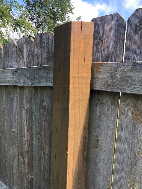 Stain over weathered gray cedar fence