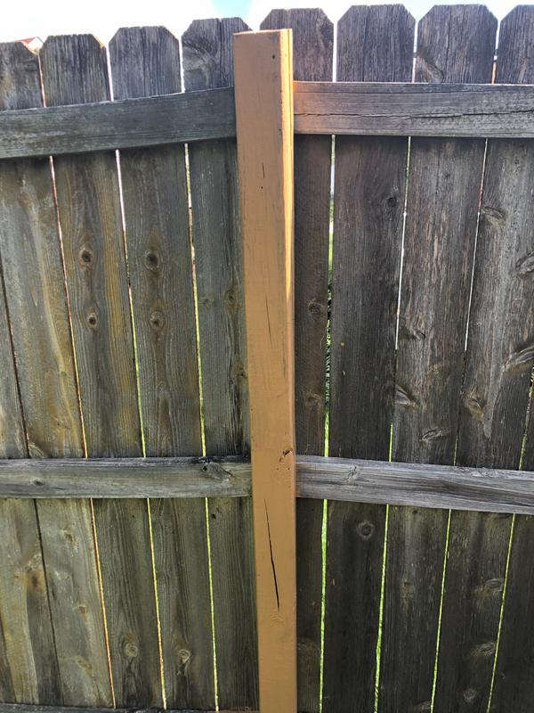 Solid stain over weathered gray cedar fence