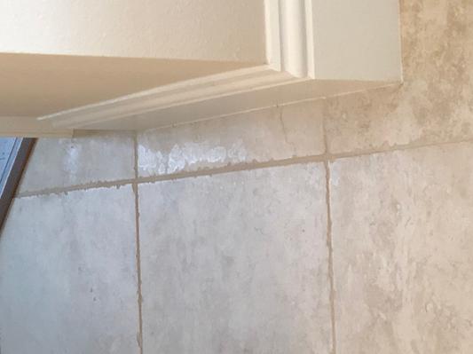 Waxy stain along baseboard