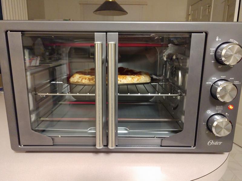 OSTER FRENCH DOOR AIR FRY OVEN IN BOX - Earl's Auction Company