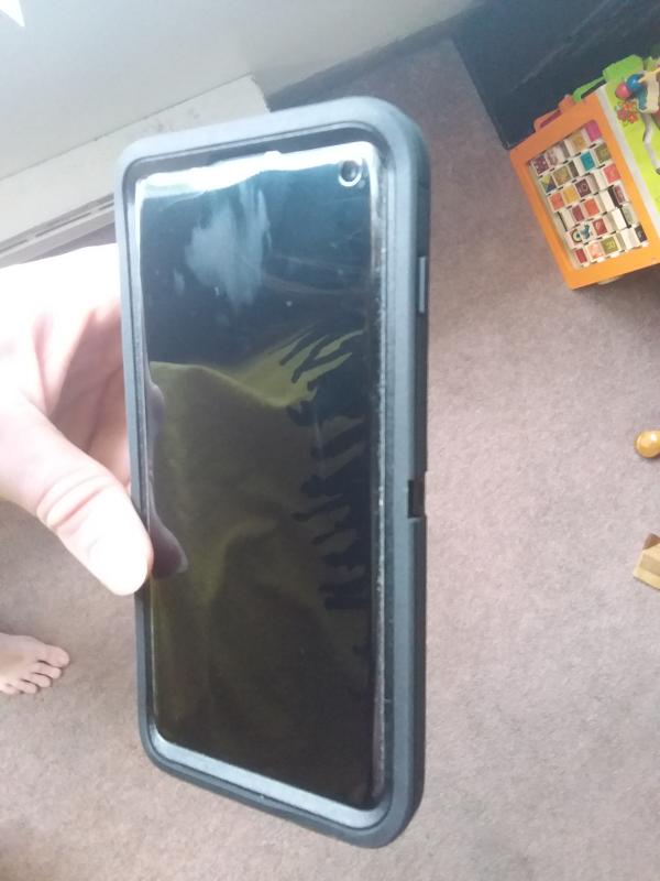 Dirt under edges of screen protector