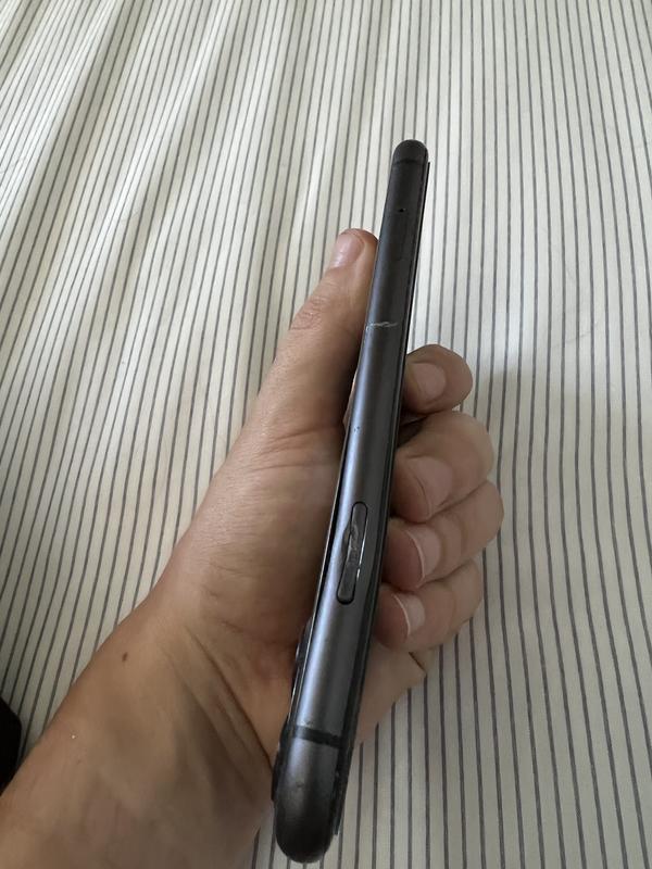 View of the dent to the power button on the phone.