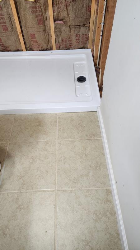 Pan sat in mortar and drain installed.