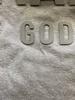 You can see under the word God the bleaching that happened and it seeped thru to the back of the shirt also.