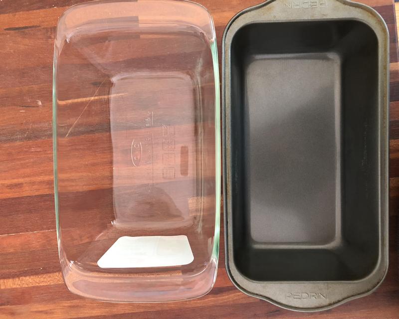 OXO glass loaf pan on the left; traditional metal pan on the right. You can see that the base of the OXO pan is smaller.