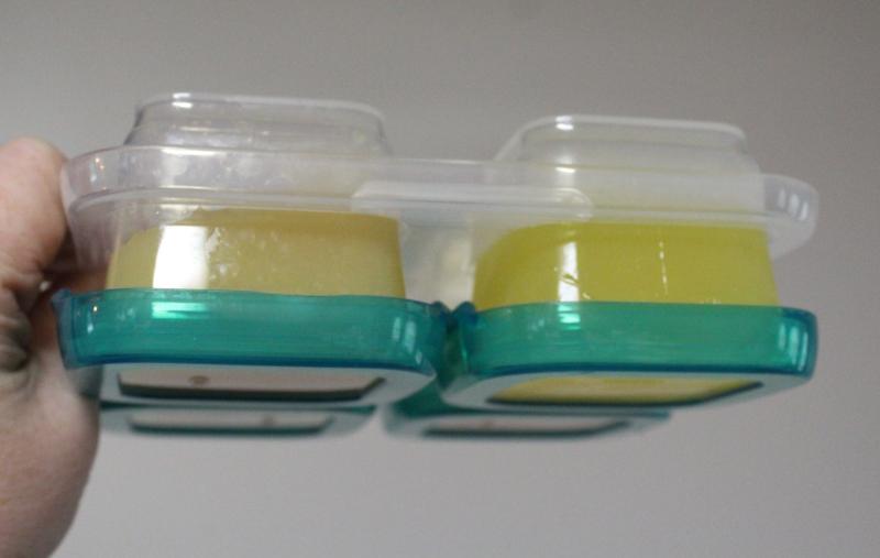 upside down in the freezer storage tray, nothing drips and everything stays secured