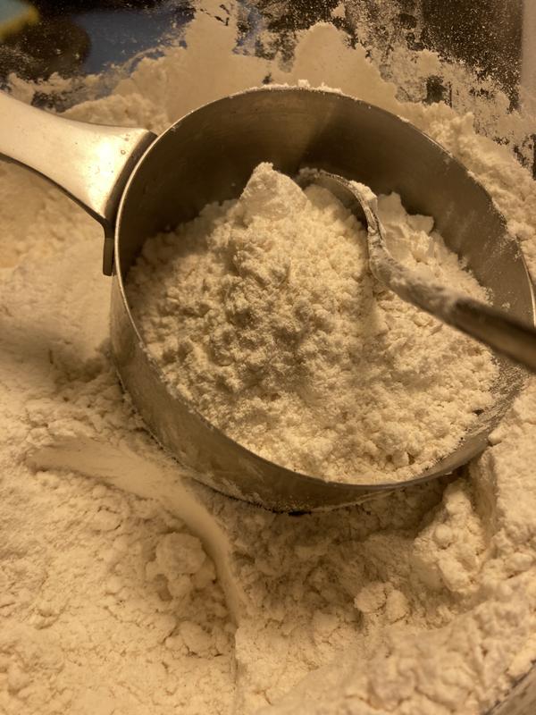 Wide enough to easily scoop flour into a 1 cup measuring cup